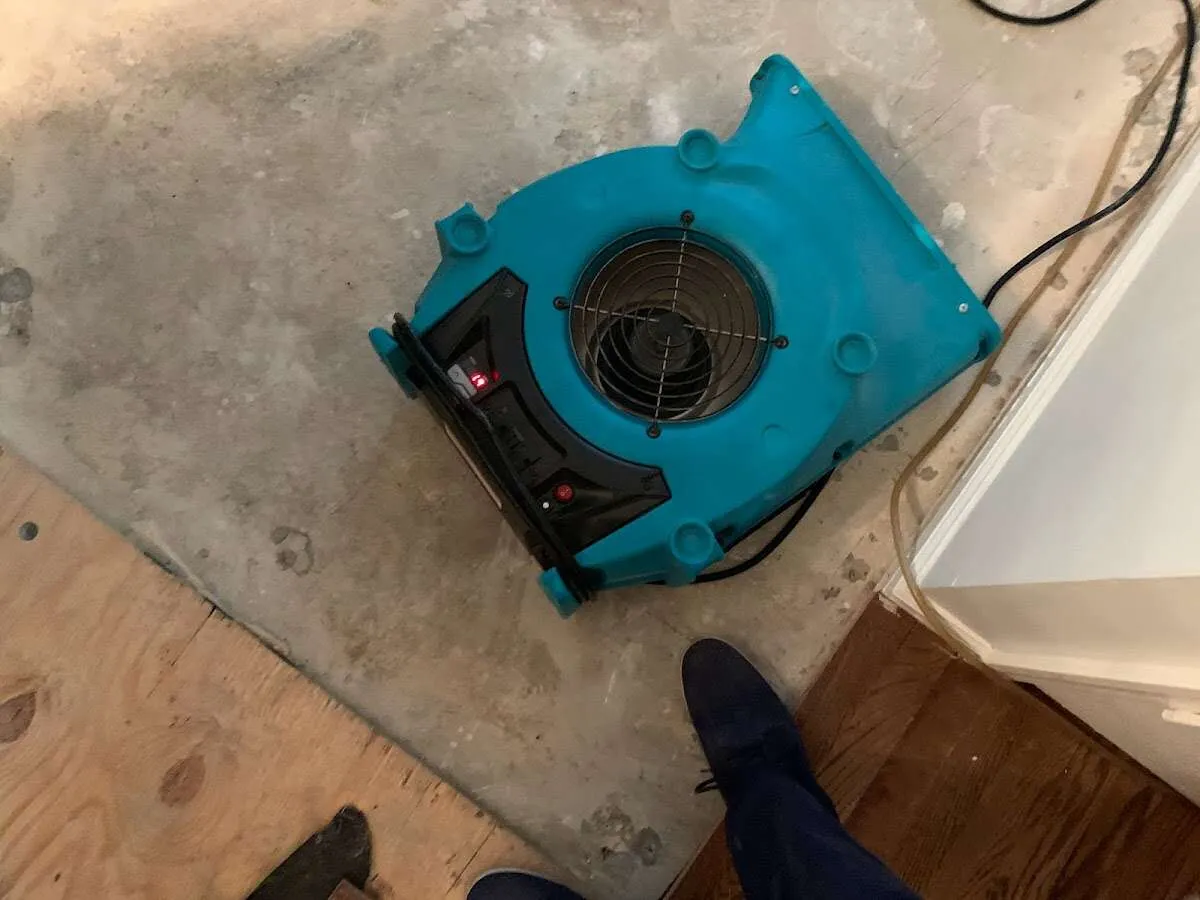 Air mover drying subfloor during Commercial Water Damage Restoration in Hazel Crest